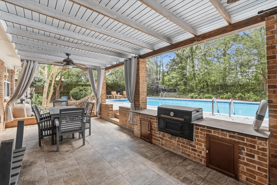 Outdoor patio with pool view