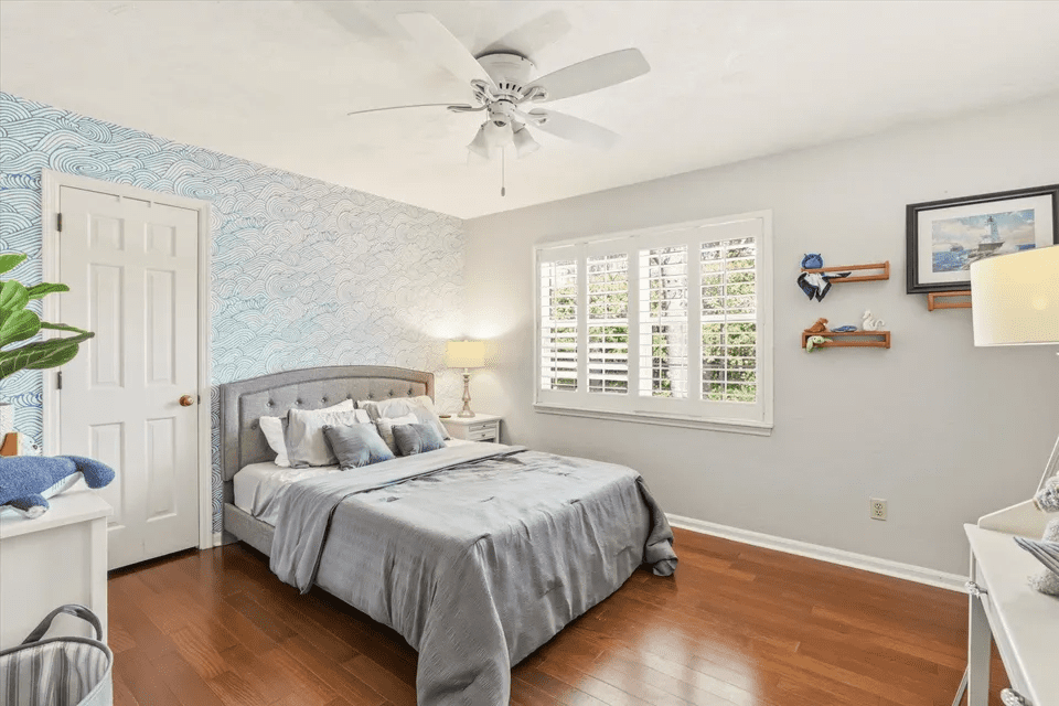 Cozy bedroom with wooden floor