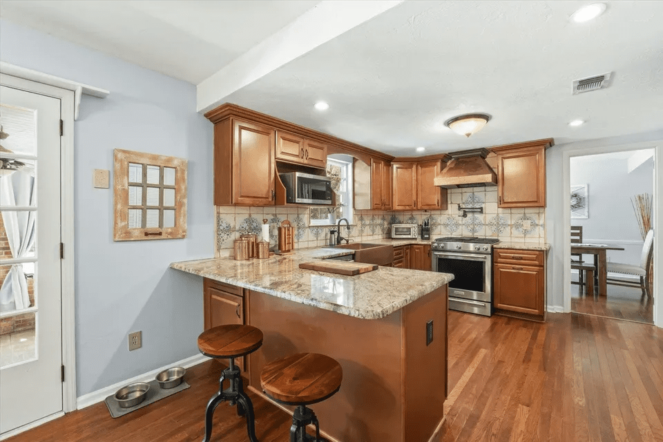 Cozy kitchen with bar stools and lighting