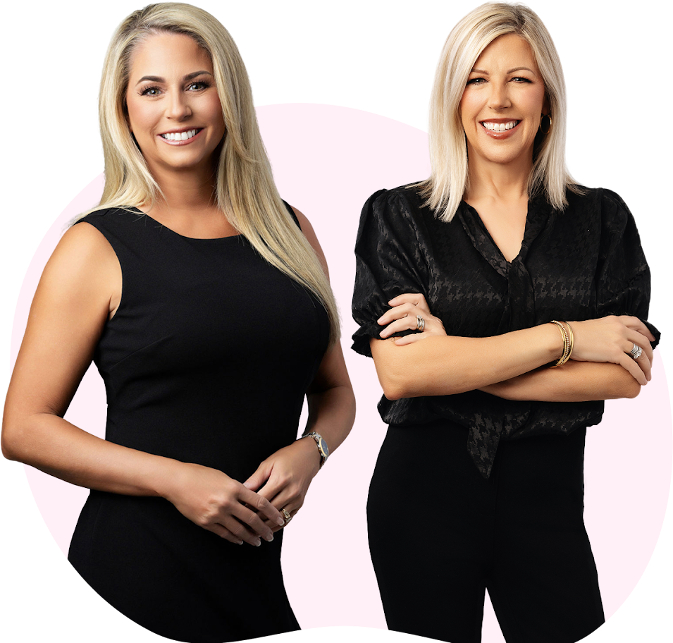 Two confident women smiling, dressed in black.