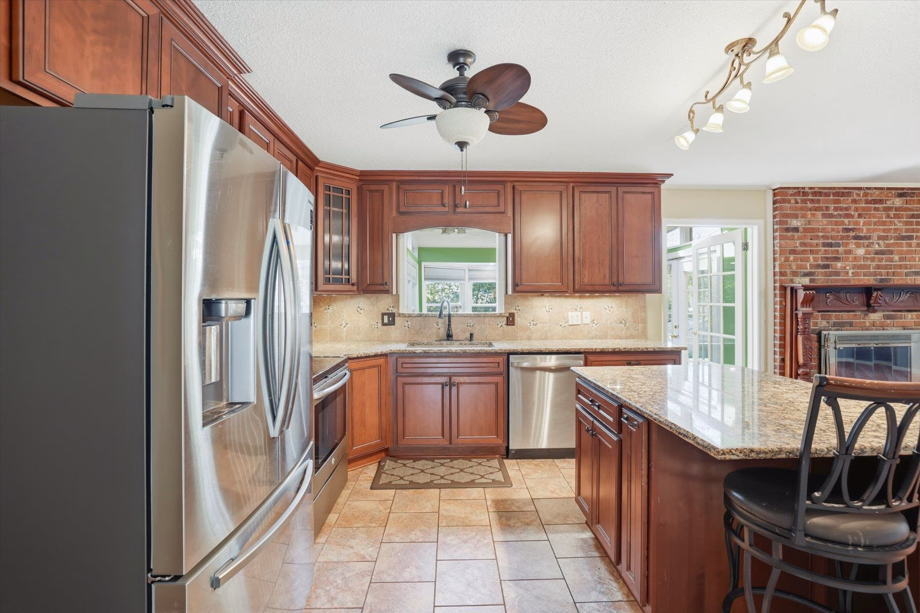 Modern kitchen with wooden cabinets and stainless steel appliances.