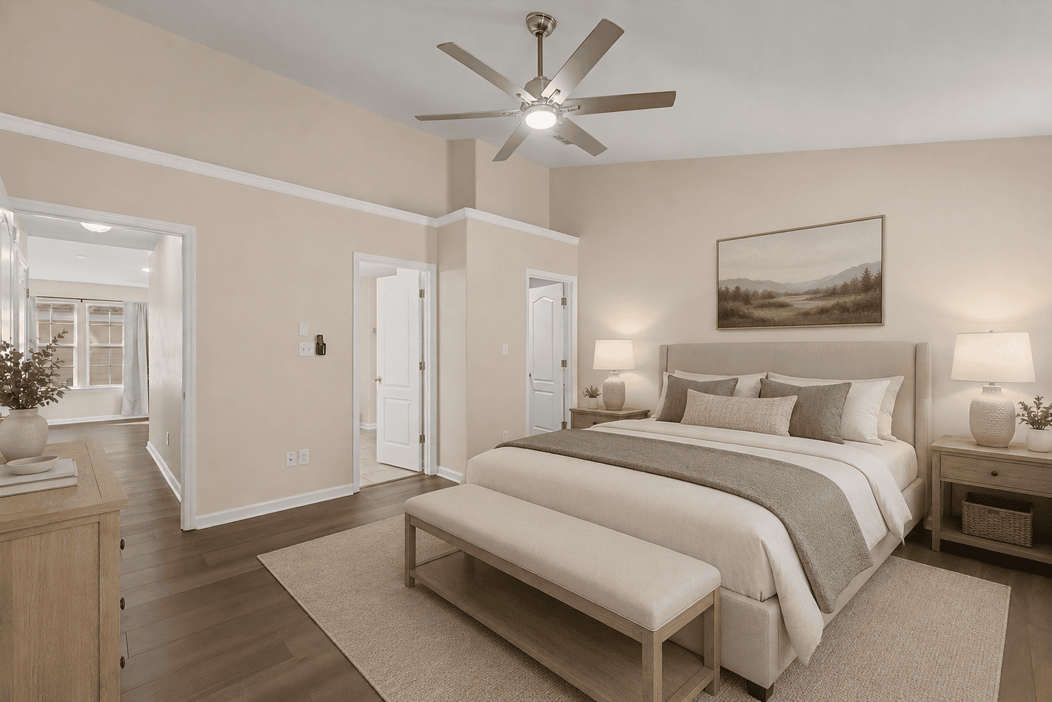 Neutral master bedroom with bench and fan